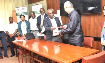 The representative of Makerere University Vice Chancellor, also Dean SFEGS, Dr Revocatus Twinomuhangi handing over signed MoU to the Vice President of NUIST. Makerere University-Nanjing University of Information Science and Technology (NUIST) MoU Signing to formalize collaboration in teaching and learning, research and publication, technology transfer, and resource mobilization, 12th July 2024, School of Forestry, Environmental, and Geographical Sciences (SFEGS) Board Room, College of Agricultural and Environmental Sciences (CAES), Kampala Uganda, East Africa.