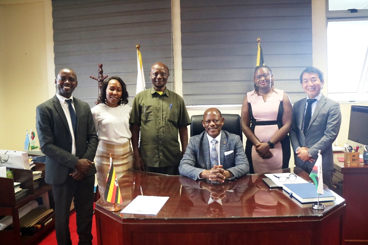 The Vice Chancellor, Prof. Barnabas Nawangwe (Seated) with Prof. Peter Baguma (3rd Left) and the delegation from Ashinaga Uganda during the meeting on 23rd July 2024 at Makerere University. Kampala Uganda, East Africa.