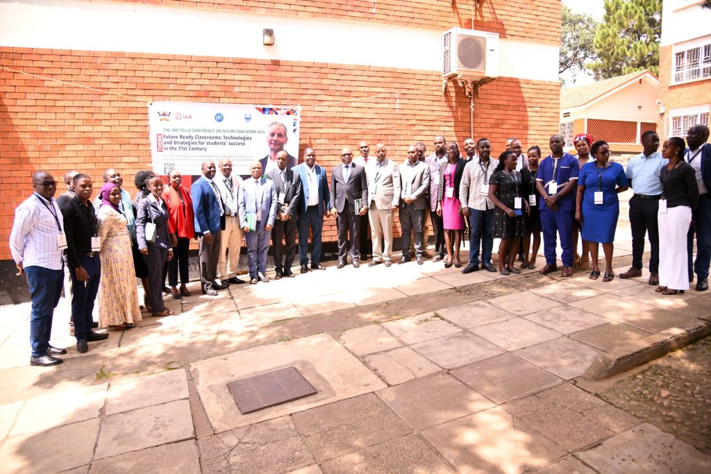 Participants pose for a group photo. Transformative Education and Lifelong Learning for Sustainable Growth (TELLS) conference, NORHED II (2021-2026), College of Education and External Studies (CEES), "Future Ready Classrooms: Technologies and Strategies for Student Success in the 21st Century," 7th-8th August 2024, The Conference Room, Level 2, Block B, College of Business and Management Sciences (CoBAMS), Makerere University, Kampala Uganda, East Africa.