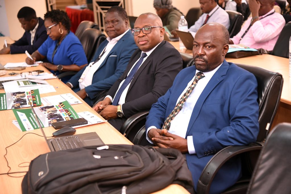 Right to Left: Prof. Paul Birevu Muyinda, Prof. Ronald Bisaso, Dr. David Onen and other participants at the conference. Transformative Education and Lifelong Learning for Sustainable Growth (TELLS) conference, NORHED II (2021-2026), College of Education and External Studies (CEES), "Future Ready Classrooms: Technologies and Strategies for Student Success in the 21st Century," 7th-8th August 2024, The Conference Room, Level 2, Block B, College of Business and Management Sciences (CoBAMS), Makerere University, Kampala Uganda, East Africa.