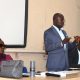 Dr. Muhammad Kiggundu Musoke (Centre) flanked by Ms. Joanna Kayaga (Left) and Mr. Kansiime Edward (Right) addresses students. College of Education and External Studies (CEES), Senior 6 students from Mbogo High School Career Guidance Session, August 2024, School of Education, Makerere University, Kampala Uganda, East Africa.