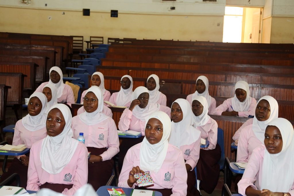 Some of the students listen to staff from CEES. College of Education and External Studies (CEES), Senior 6 students from Mbogo High School Career Guidance Session, August 2024, School of Education, Makerere University, Kampala Uganda, East Africa.