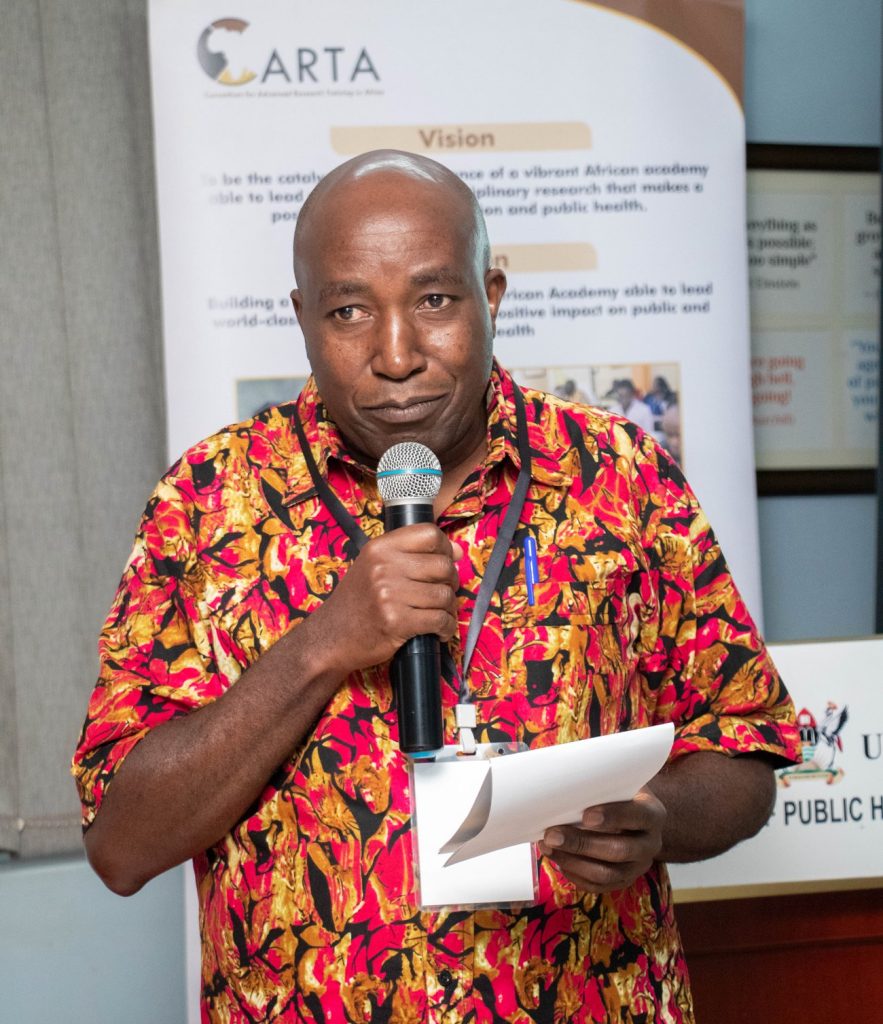 Dr. Joseph Gichuru Wang'ombe, Deputy Executive Director at APHRC -Nairobi speaks to participants of the APAS training in Kampala. Consortium for Advanced Research Training in Africa (CARTA) week-long training for Academic, Professional, and Administration Staff (APAS) and Trainers of Trainers (ToTs), 12th to 16th August 2024, at Makerere University, School of Public Health - ResilientAfrica Network (MakSPH-RAN), Plot 28, Upper Kololo Terrace, Kampala, Uganda, East Africa.