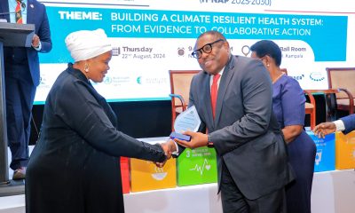 Rt. Hon. Lukia Isanga Nakadama, the 3rd Deputy Prime Minister and woman MP Mayuge District hands over an award to Mr. William Asiko, Vice President and head of The Rockefeller Foundation’s Africa Regional Office during the launch of the Climate Change Health National Adaptation Plan-H-NAP (2025-2030) on 22nd August 2024. Makerere University School of Public Health (MakSPH) at the Ministry of Health launch of the National Climate Change Health National Adaptation Plan (H-NAP), 22nd August 2024, Sheraton Kampala Hotel, Kampala Uganda, East Africa.