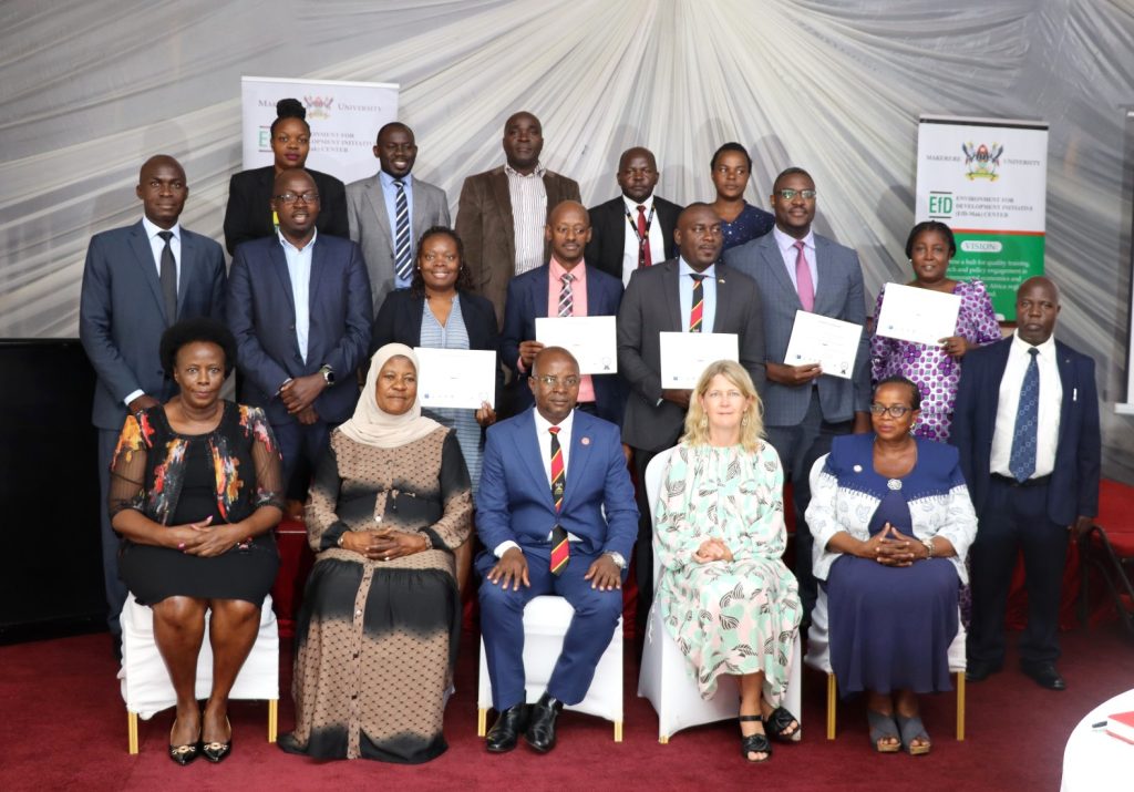 Graduating IGE fellows posing for a group photo with the Ambassador Maria Håkansson (Seated 2nd R) and EfD Director Prof. Edward Bbaale (Seated Centre). EfD Uganda, Makerere University, Kampala Uganda, East Africa graduation of Third Cohort of the Inclusive Green Economy (IGE) Capacity Building Program Fellows, 7th August 2024, Kampala Sheraton Hotel.