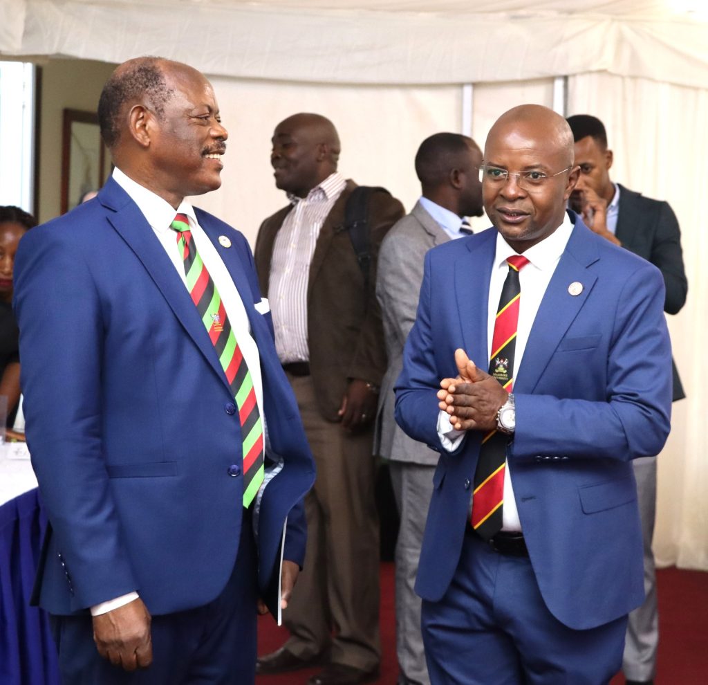 Prof. Barnabas Nawangwe and Prof. Edward Bbaale interacting before the opening session. EfD Uganda, Makerere University, Kampala Uganda, East Africa graduation of Third Cohort of the Inclusive Green Economy (IGE) Capacity Building Program Fellows, 7th August 2024, Kampala Sheraton Hotel.