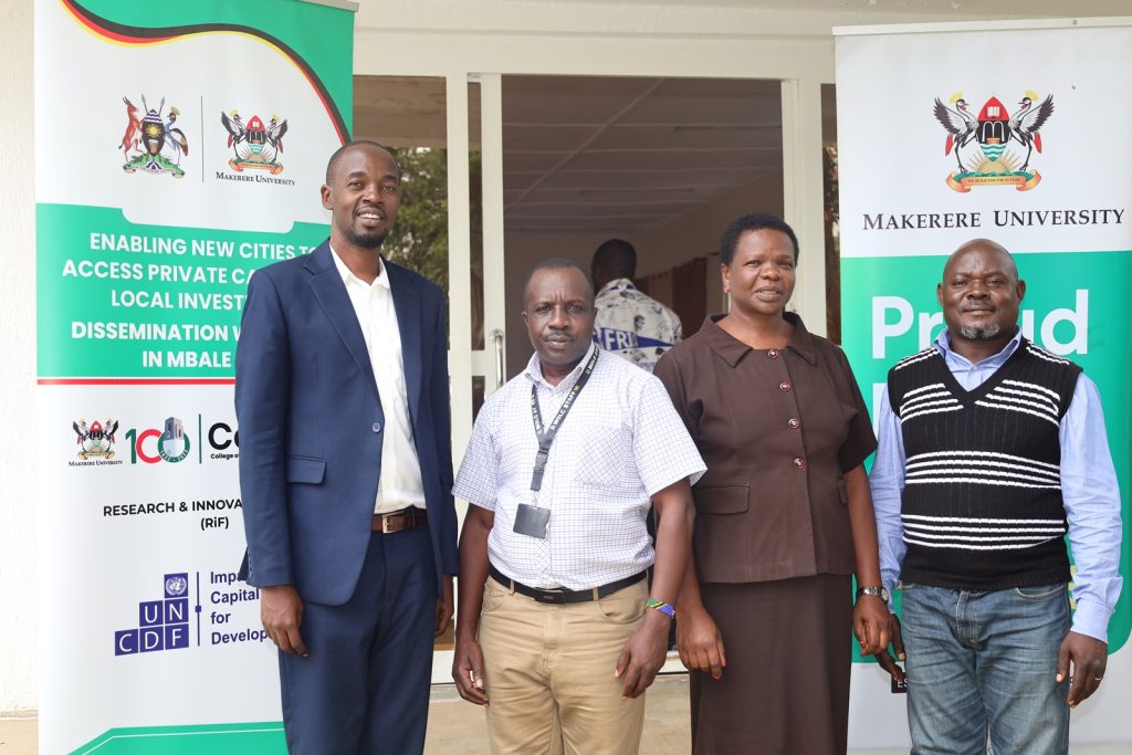 Left to Right: Dr. Yusuf Kiwala, Mr. Julius Masereka, Ms. Annet Nandudu and another official. School of Business, College of Business and Management Sciences (CoBAMS), Makerere University, Kampala, Uganda, East Africa partnership with United Nations Capital Development Fund (UNCDF) to undertake a study on “Enabling new Cites to Access Private Capital for Local Investments.” for Arua and Mbale Cities, research dissemination, 1st August 2024, Mbale City. Research Team Lead: Dr. Yusuf Kiwala.