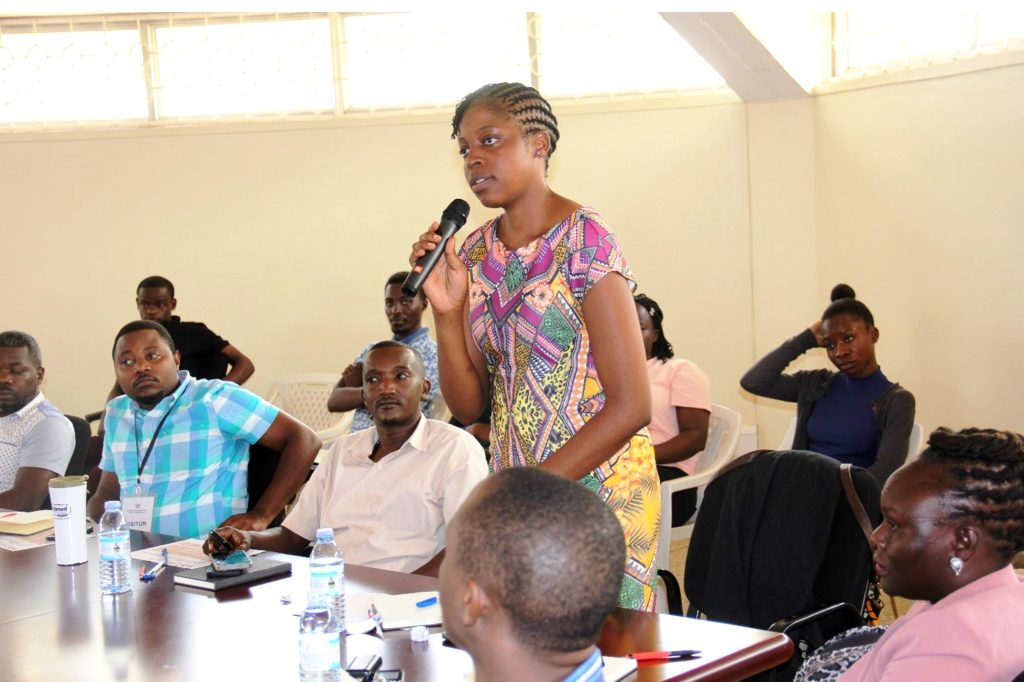 A Participant making a submission at the workshop. Makerere University and Uganda Virus Research Institute Pilot Cyberbiosecurity Project to Safeguard Laboratory Facilities, Workshop, 16th August 2024, Centre for Biosecurity and Global Health, Kampala Uganda, East Africa.