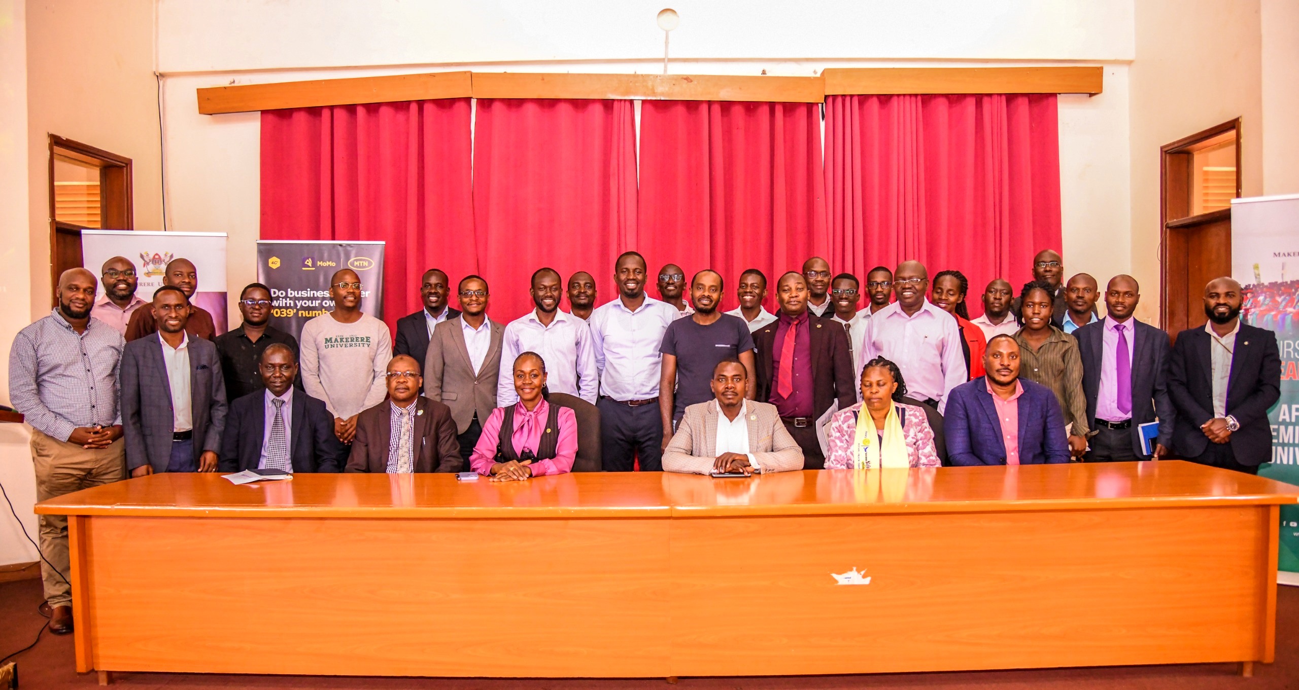 The Director DICTS-Mr. Samuel Mugabi (Seated Right) with members of Management and stakeholders at the ICT Policies Review Workshop on 13th August 2024. Conference Hall, College of Engineering, Design, Art and Technology (CEDAT), Makerere University, Kampala Uganda, East Africa.