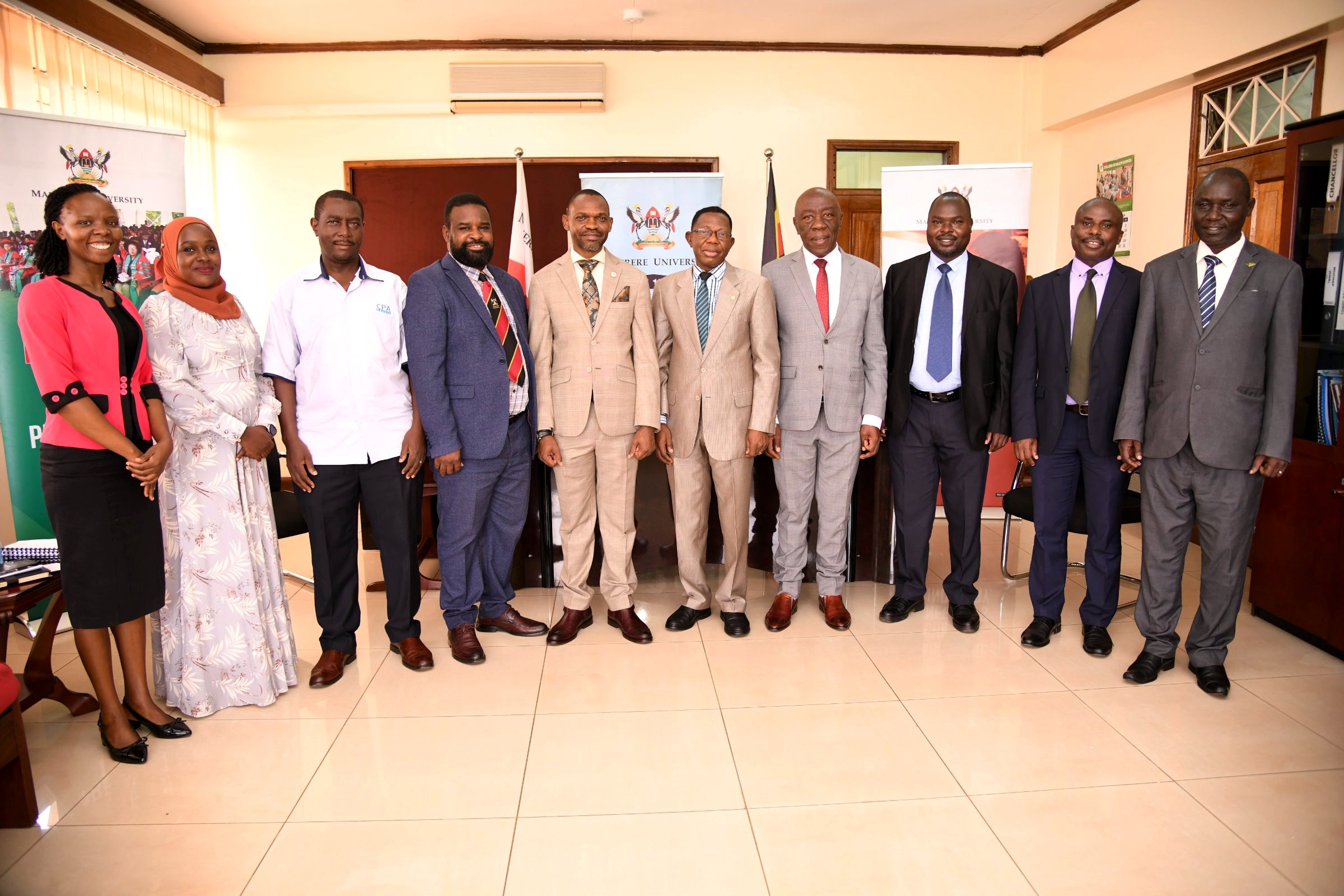 The Ag. DVCFA-Prof. Henry Alinaitwe (4th R), Incoming DVCAA-Prof. Buyinza Mukadasi (5th R), Outgoing DVCAA-Assoc. Prof. Umar Kakumba (5th L) and members of Management at the handover ceremony on 2nd August 2024.