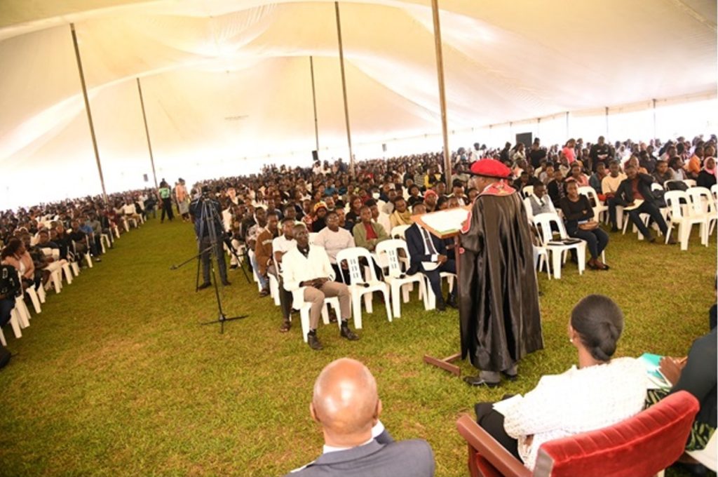 Students of the Academic Year 2024/2025 intake, listening to the presentation by the Acting Deputy Vice-Chancellor (Academic Affairs)/Academic Registrar, Prof. Buyinza Mukadasi. Freshers Orientation for Academic Year 2024/2025, 5th August 2024. Freedom Square, Makerere University, Kampala Uganda, East Africa.