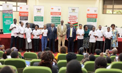 A cross-section of Scholars pose in a photo with the Vice Chancellor and Mr. Bukenya after receiving their Scholarship award letters. Mastercard Foundation Scholars Program Scholarships Award Ceremony, 20th August 2024, Makerere University School of Public Health Auditorium, Kampala Uganda, East Africa.