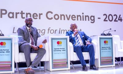 Prof. Barnabas Nawangwe (R) flanked by Mr. Adrian Bukenya, the Country Director of Mastercard Foundation (L), during the panel discussion.