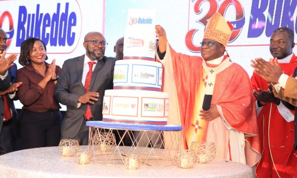 The Archbishop of Kampala, His Grace Paul Ssemogerere (2nd Right) is joined by Vision Group CEO Mr. Don Wanyama (3rd Left) and other officials to cut cake on 29th August 2024. #BukeddeAt30 Celebration Mass, Vision Group Headquarters, Plot 19-21, First Street, Industrial Area, Kampala Uganda, East Africa.