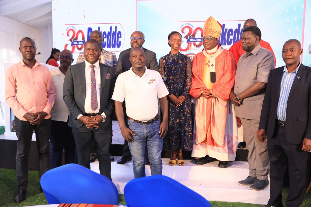 The Archbishop of Kampala, His Grace Paul Ssemogerere (3rd Right) with Vision Group staff and guests at the celebration. #BukeddeAt30 Celebration Mass, Vision Group Headquarters, Plot 19-21, First Street, Industrial Area, Kampala Uganda, East Africa.