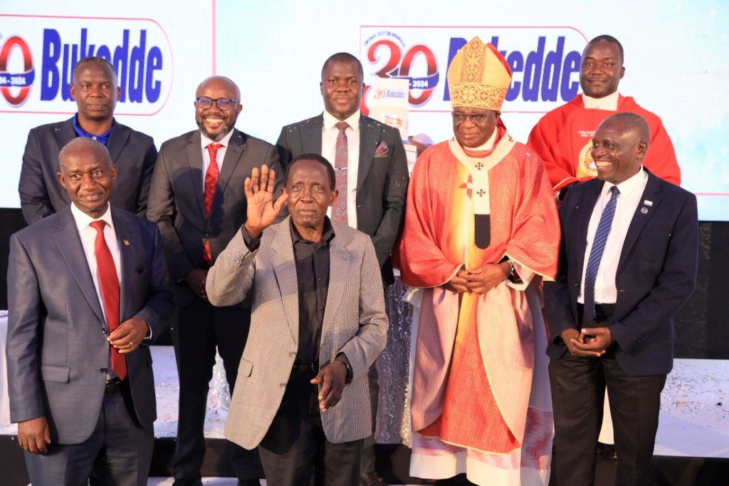 The Archbishop of Kampala, His Grace Paul Ssemogerere (3rd Right) is joined by Vision Group CEO-Mr. Don Wanyama (Rear 2nd Left), Deputy CEO-Mr. Gervase Ndyanabo (Front Left), Founding Bukedde Editor-Mr. Maurice Ssekawungu (Waving), His successor-Mr. Geoffrey Kulubya (Right), Current Bukedde Editor-Mr. Michael Ssebbowa (Rear Left) and other officials. #BukeddeAt30 Celebration Mass, Vision Group Headquarters, Plot 19-21, First Street, Industrial Area, Kampala Uganda, East Africa.