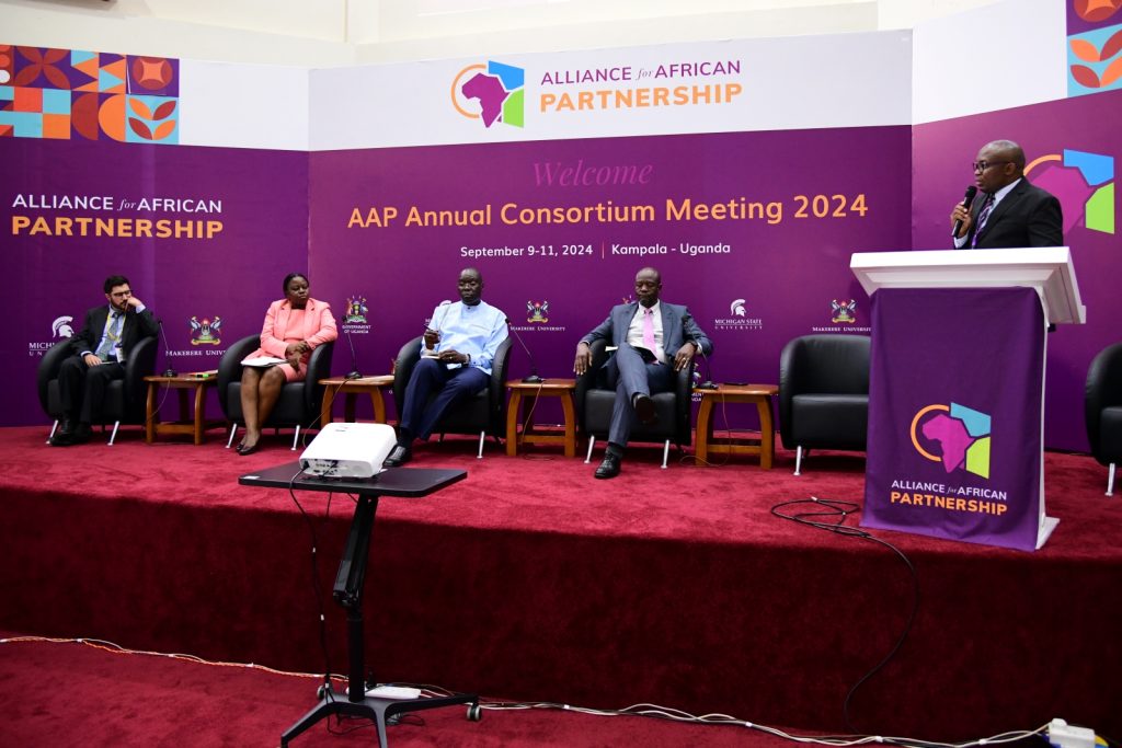 Alliance for African Partnership (AAP) of Prof. Ronald Bisaso (Standing) moderated the panel discussion. Michigan State University (MSU) Annual Consortium Meeting. Hosted by Makerere University in the School of Public Health Conference Hall, Kampala Uganda, East Africa 9th-11th September 2024.