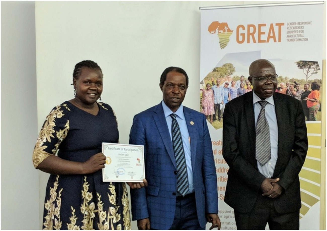 Ms Hellen Opie from NARO, and a PhD Student of Agricultural and Rural Innovations at CAES (L) receives her certificate from the former Deputy Vice-Chancellor, Prof. William Bazeyo (M), and the former Ag Executive Director of ASARECA (R) (2018). Makerere University and the CGIAR, in August 2024, renewed their Memorandum of Understanding (MoU) to accelerate efforts to create more inclusive agricultural systems in Africa with funding of US$ 99,935 through the CGIAR GENDER Impact Platform. Kampala Uganda, East Africa.