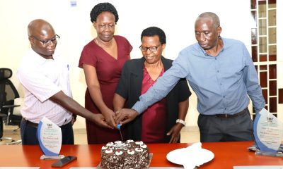 Left to Right: Dr. Justus Twesigye, Dean of the School of Social Sciences cuts cake with Retirees: Ms. Doreen Anek, Ms. Kitty Tweyanze and Mr. Jackson Byamugisha. School of Social Sciences, College of Humanities and Social Sciences (CHUSS), Makerere University, Kampala Uganda, East Africa, farewell ceremony to honor three retired staff members for their exemplary service. Retirees Ms. Doreen Anek, the Senior Assistant Registrar; Ms. Kitty Tweyanze, Senior Administrative Secretary; and Mr. Jackson Byamugisha, a Security guard, 2nd September 2024.