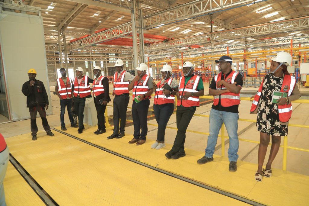 The team receives a briefing from one of the KMC Engineers during a tour of the vehicle plant. EfD-Mak Team and Inclusive Green Economy (IGE) fellows led by Uganda’s Policy Engagement Specialist Dr. Peter Babyenda visit Uganda’s Pioneer Motor Vehicle Company engaged in the production of Electric and solar powered vehicles – the Kiira Motors Corporation (KMC), 17th September 2024, Jinja, East Africa.