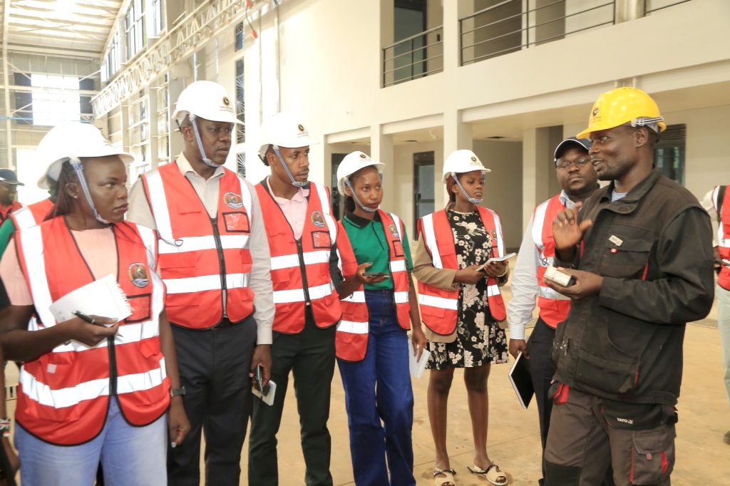 The team listens to one of the KMC Engineers. EfD-Mak Team and Inclusive Green Economy (IGE) fellows led by Uganda’s Policy Engagement Specialist Dr. Peter Babyenda visit Uganda’s Pioneer Motor Vehicle Company engaged in the production of Electric and solar powered vehicles – the Kiira Motors Corporation (KMC), 17th September 2024, Jinja, East Africa.