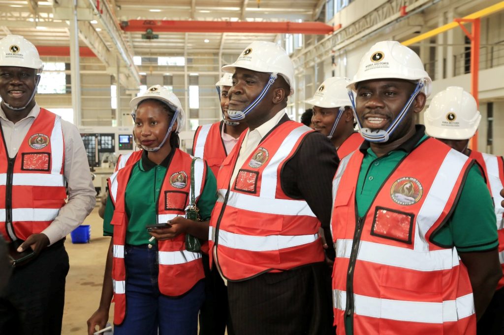 Dr. Peter Babyenda (Right) Dr. John Seruyange (2nd Right) and other team members during a tour of the facility. EfD-Mak Team and Inclusive Green Economy (IGE) fellows led by Uganda’s Policy Engagement Specialist Dr. Peter Babyenda visit Uganda’s Pioneer Motor Vehicle Company engaged in the production of Electric and solar powered vehicles – the Kiira Motors Corporation (KMC), 17th September 2024, Jinja, East Africa.