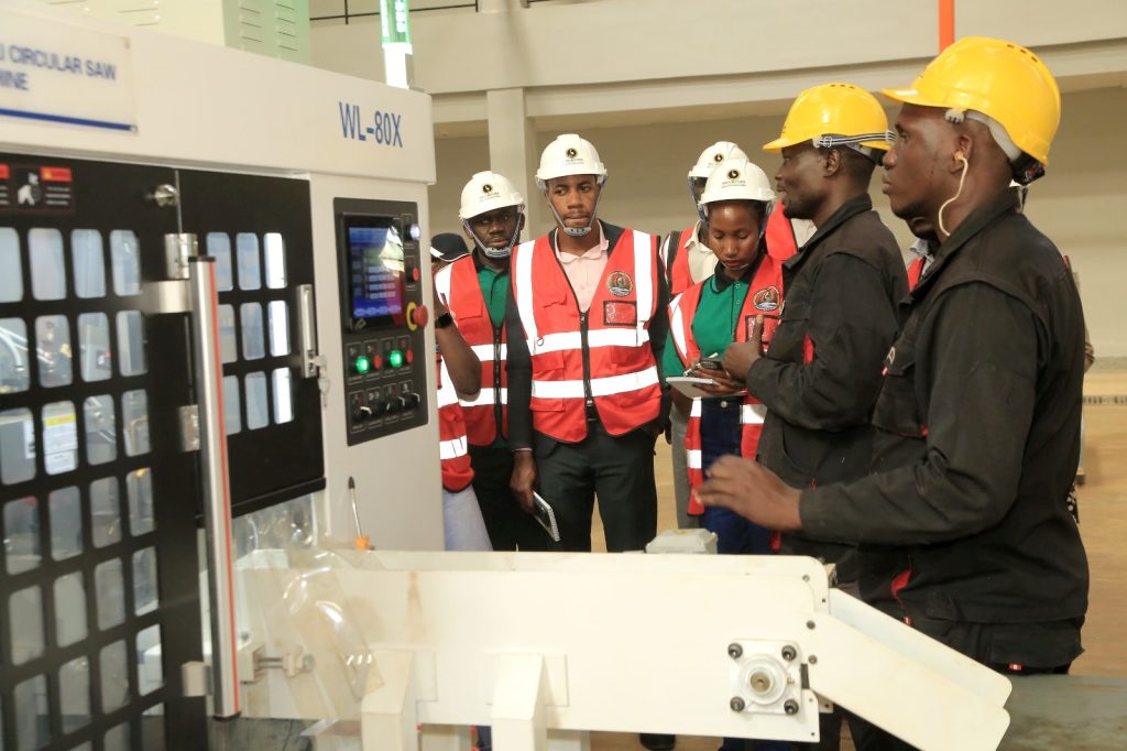 The team views the Circular Saw in action. EfD-Mak Team and Inclusive Green Economy (IGE) fellows led by Uganda’s Policy Engagement Specialist Dr. Peter Babyenda visit Uganda’s Pioneer Motor Vehicle Company engaged in the production of Electric and solar powered vehicles – the Kiira Motors Corporation (KMC), 17th September 2024, Jinja, East Africa.