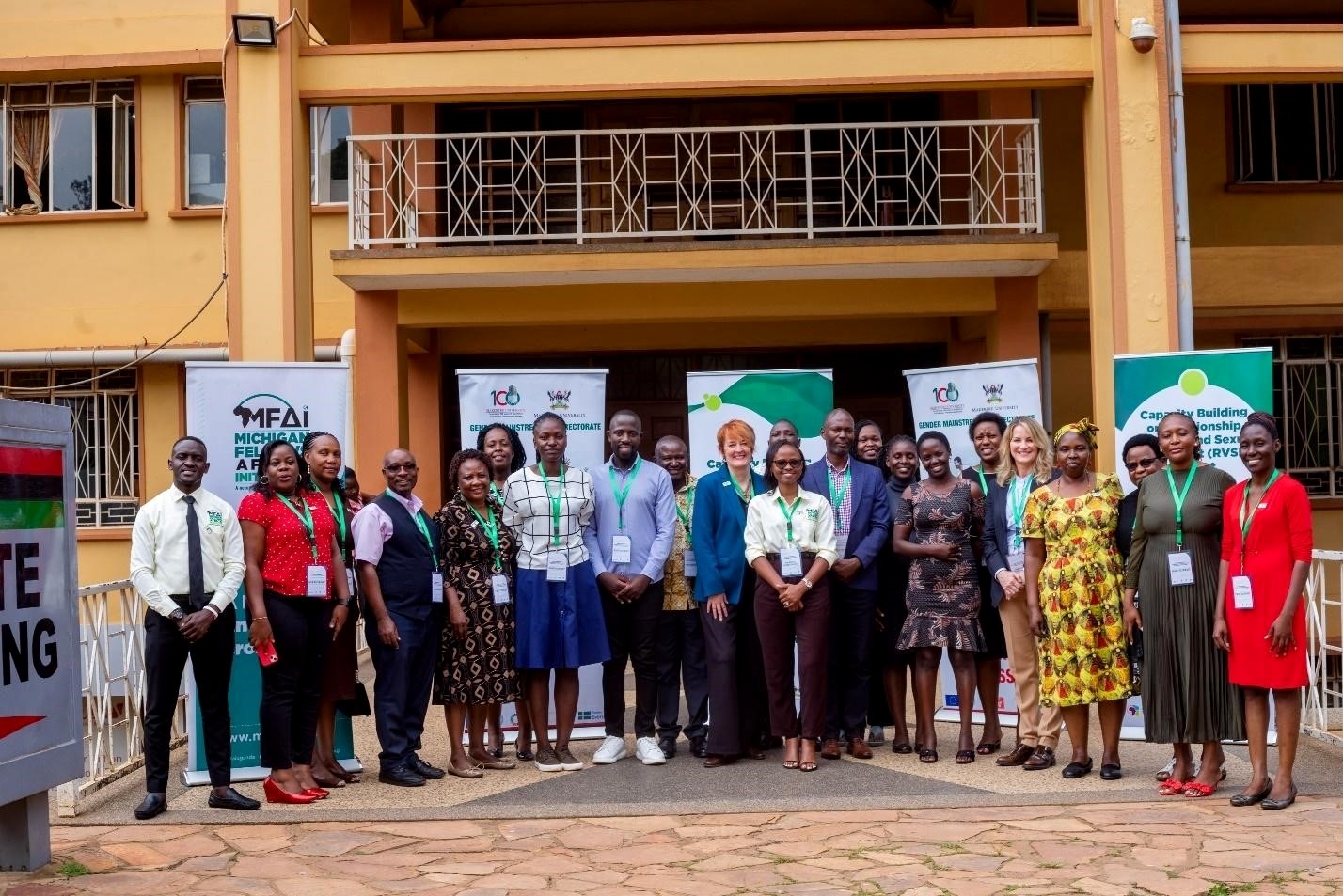 Participants in the Gender Mainstreaming Directorate (GMD) - Michigan State University (MSU) - Michigan Fellows Africa Initiative (MFAI) Uganda symposium pose for a group photo outside the Senate Building on 10th September 2024. Gender Mainstreaming Directorate, in collaboration with Michigan State University (MSU) and the Michigan Fellows Africa Initiative (MFAI) Uganda, symposium aimed at raising awareness among university staff on how to address sexual harassment and related incidents, Telepresence Centre, Senate Building, Makerere University, Kampala Uganda, East Africa 10th September 2024.