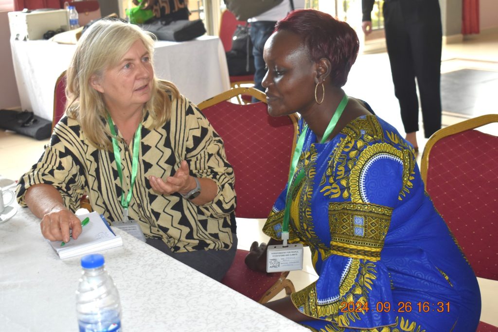 PhD student Patricia interacting with her supervisor Dr Anne Mette Lykke at the workshop. College of Agricultural and Environmental Sciences (CAES), Makerere University, Kampala Uganda, East Africa, DANIDA-funded Agroforestry for People, Ecosystems and Climate Change (AfPEC) project (March 2024-April 2029) focusing on Mt. Elgon Highlands in Eastern Uganda Inception Meeting in Mbale City, 25th-26th September 2024.