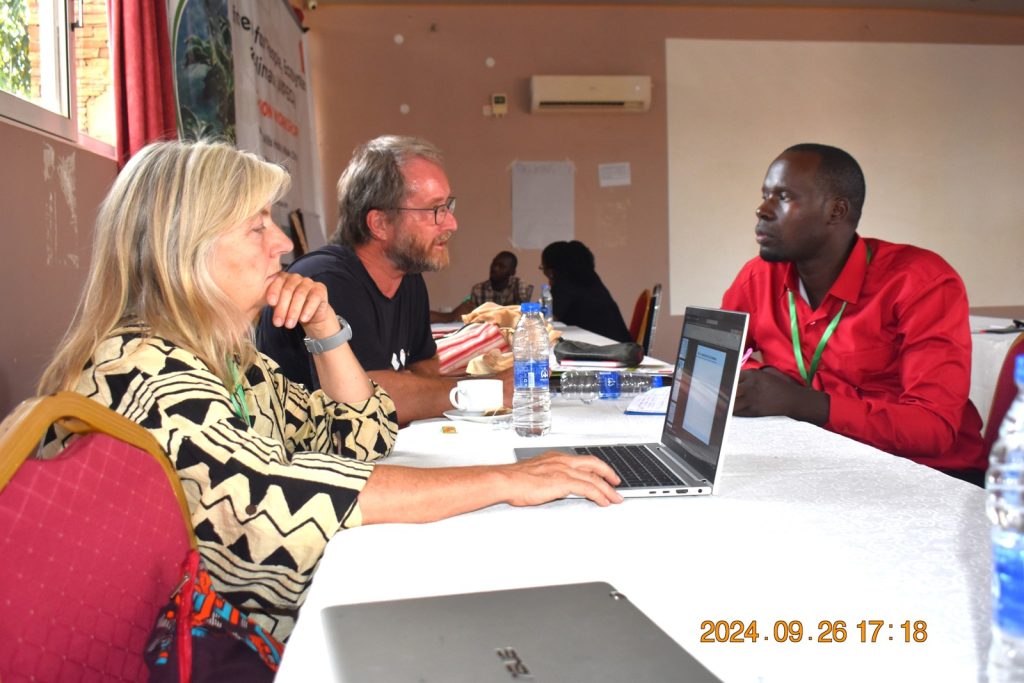 PhD student Derick Kisegu discussing his project with his supervisors. College of Agricultural and Environmental Sciences (CAES), Makerere University, Kampala Uganda, East Africa, DANIDA-funded Agroforestry for People, Ecosystems and Climate Change (AfPEC) project (March 2024-April 2029) focusing on Mt. Elgon Highlands in Eastern Uganda Inception Meeting in Mbale City, 25th-26th September 2024.