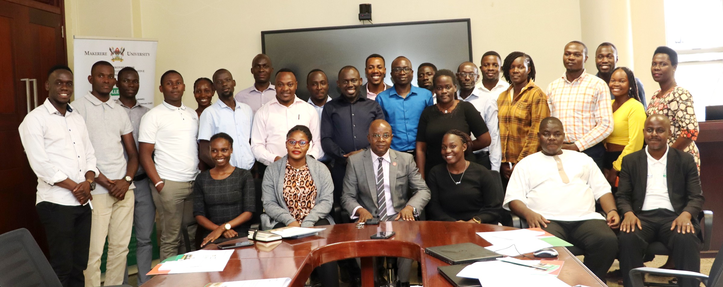 Participants posing for a group photo with the Centre Director Edward Bbale (Front Row 3rd Left) after the opening ceremony. Environment for Development (EfD) Mak Centre Specialized Training aimed at enhancing 30 researchers' and graduate students' skills in research co-creation, science communication, and policy engagement, 15th October 2024, Yusuf Lule Central Teaching Facility, Makerere University, Kampala Uganda, East Africa.