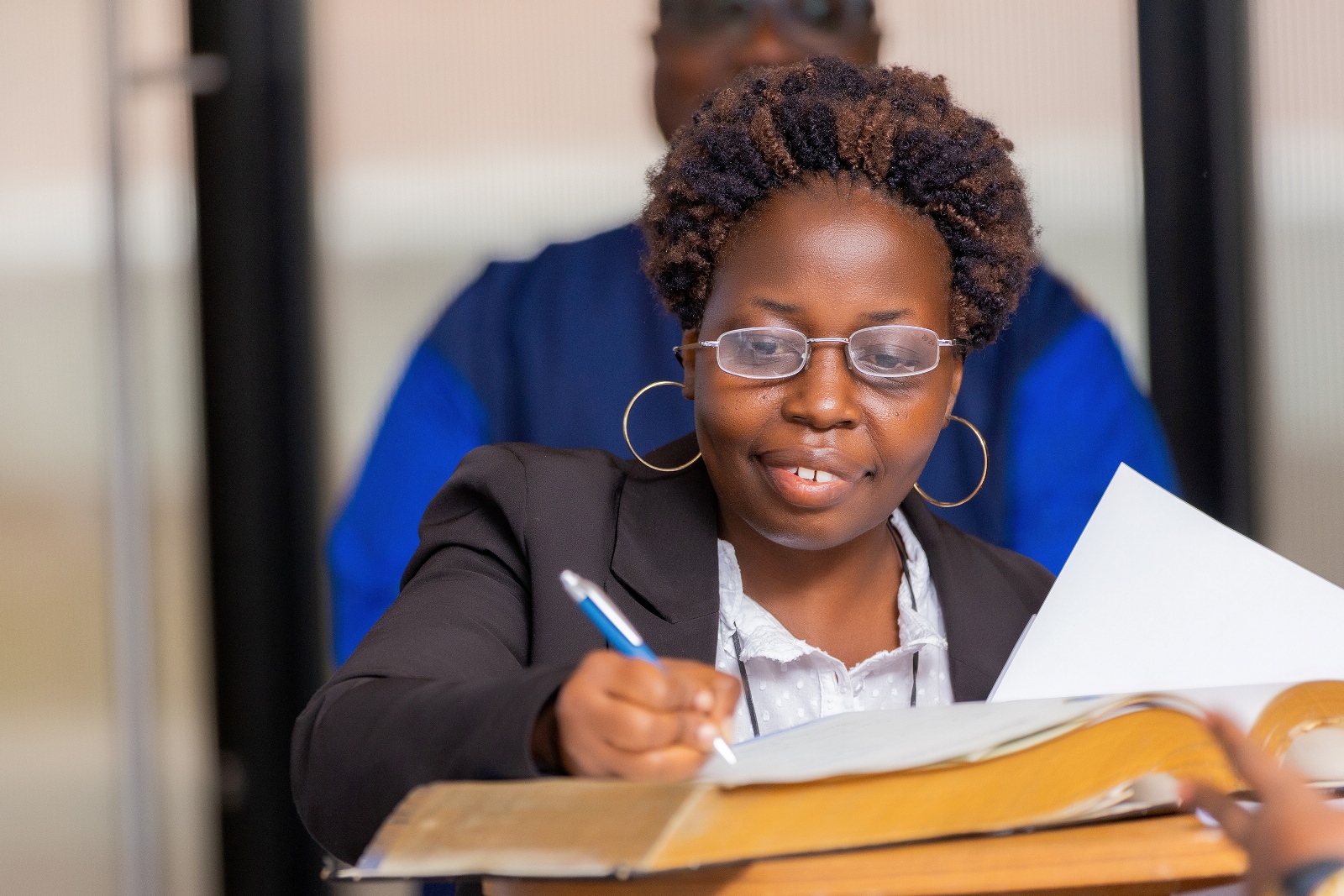 Dr. Victoria Nankabirwa signs an Oath during the induction ceremony on Friday. Four Makerere University School of Public Health (MakSPH) faculty induction into the 2024 Uganda National Academy of Sciences (UNAS) fellowship, 1st November 2024, Four Points by Sheraton, Kampala Uganda, East Africa.