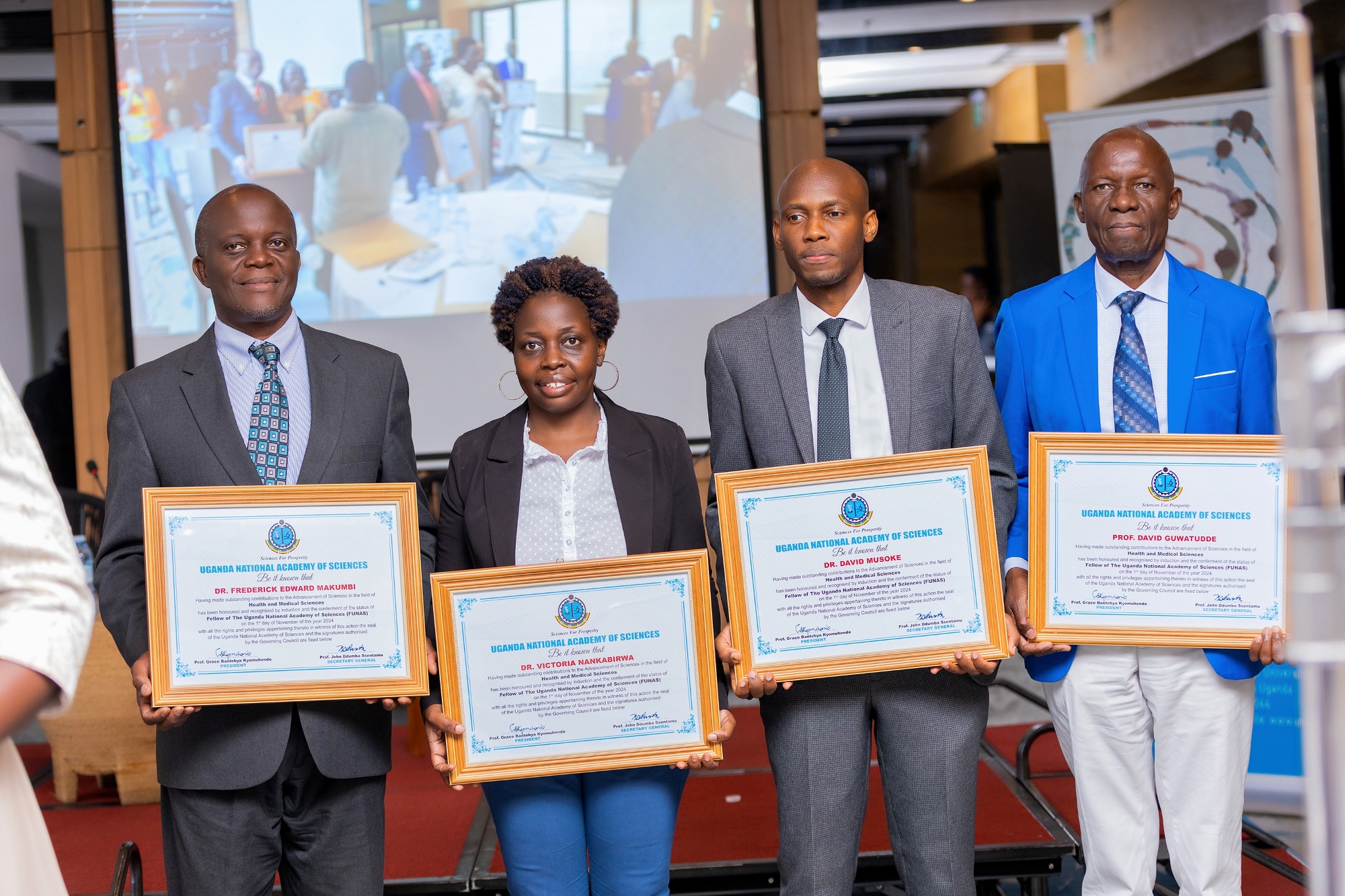 The four MakSPH Staff inducted into the UNAS Fellowship on 1st November 2024 from Left to Right: Dr. Fredrick Edward Makumbi, Dr. Victoria Nankabirwa, Dr. David Musoke and Professor David Guwatudde. Four Makerere University School of Public Health (MakSPH) faculty induction into the 2024 Uganda National Academy of Sciences (UNAS) fellowship, 1st November 2024, Four Points by Sheraton, Kampala Uganda, East Africa.