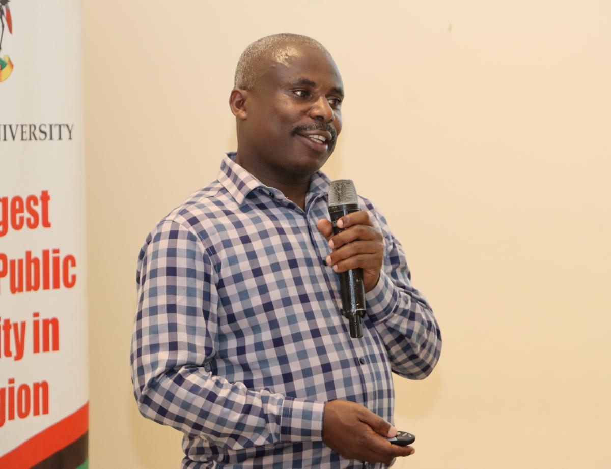 Makerere University’s Chief Human Resource Officer, Deus Tayari Mujuni makes his presentation at the CHUSS Retreat. Makerere University College of Humanities and Social Sciences (CHUSS) Staff Retreat, 1st-2nd November 2024, Nican Resort Hotel, Seguku Entebbe Road, Kampala Uganda, East Africa.