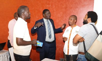 The Quality Assurance Director Dr. Cyprian Misinde (C) interacts with staff after the presentations on 1st November 2024. Makerere University College of Humanities and Social Sciences (CHUSS) Staff Retreat, 1st-2nd November 2024, Nican Resort Hotel, Seguku Entebbe Road, Kampala Uganda, East Africa.