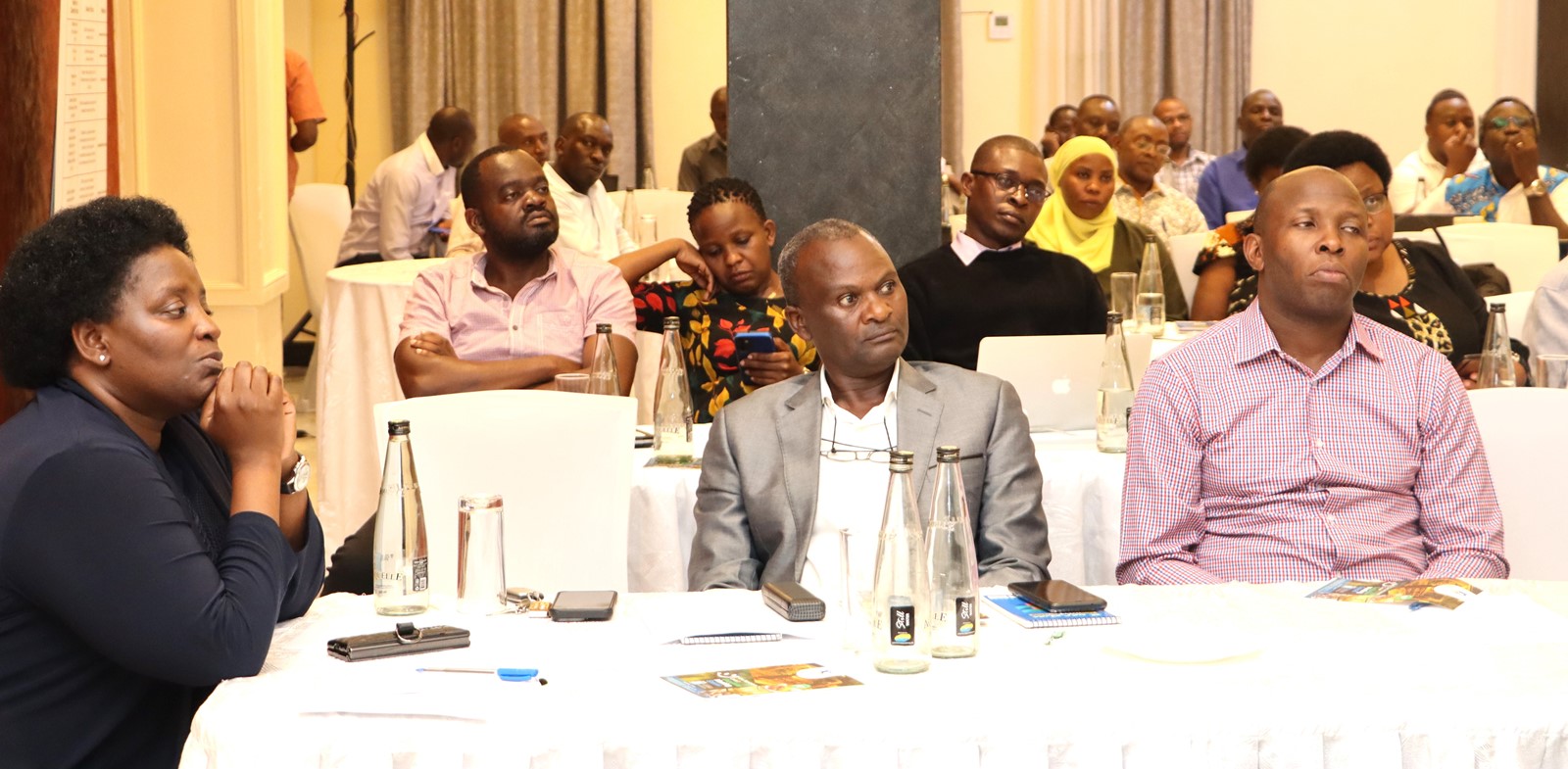 Prof. Helen Nkabala and some staff listening to Mr Yusuf Kiranda. Makerere University College of Humanities and Social Sciences (CHUSS) Staff Retreat, 1st-2nd November 2024, Nican Resort Hotel, Seguku Entebbe Road, Kampala Uganda, East Africa.