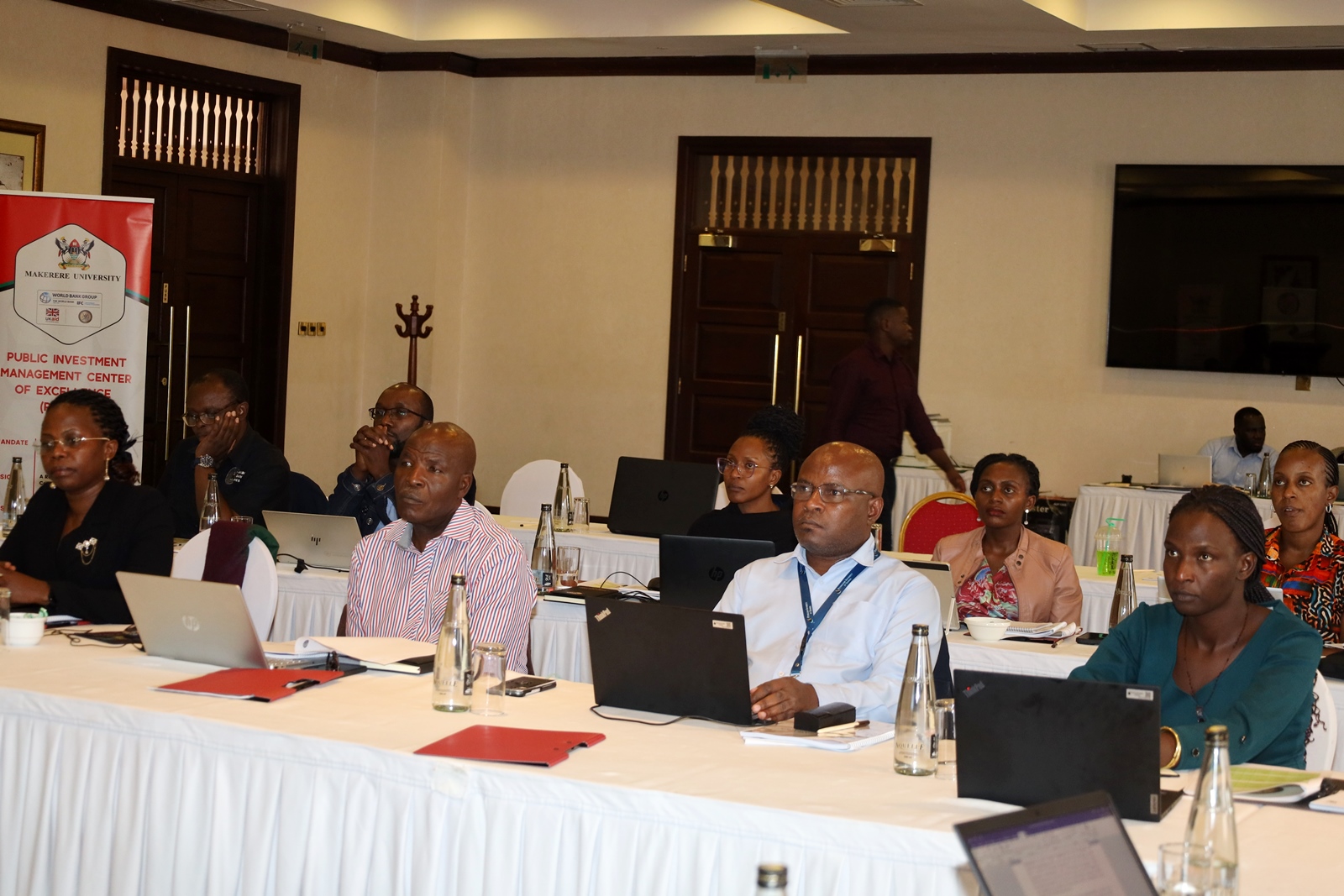 Participants attend the training. Public Investment Management Centre of Excellence (PIM CoE) at Makerere University, in partnership with the Ministry of Finance, Planning & Economic Development (MoFPED), intensive training program aimed at enhancing public officers' skills in assessing the financial implications of proposed policies and legislation, 5th November 2024, Lake Victoria Serena Golf Resort, Kigo, Wakiso, Uganda, East Africa.