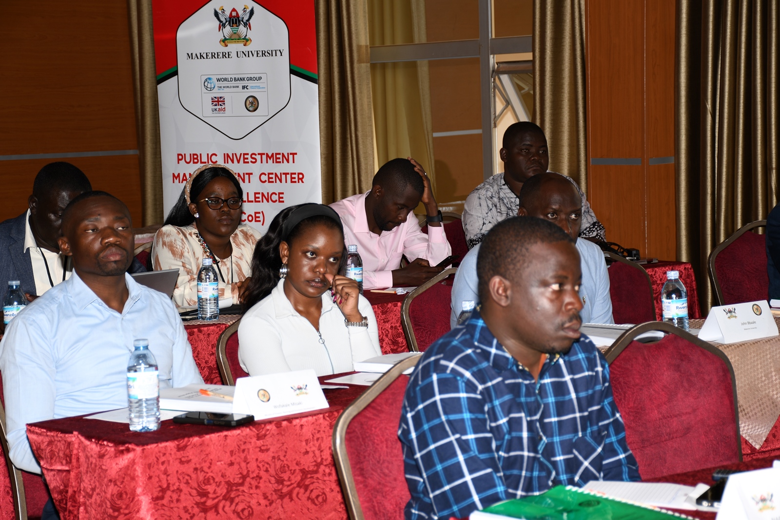 Some of the participants follow proceedings. Public Investment Management (PIM) Centre of Excellence, College of Business and Management Sciences (CoBAMS), Makerere University, Kampala Uganda, East Africa advanced capacity-building training on Economic and Stakeholder Analysis commencement, 25th November 2024.