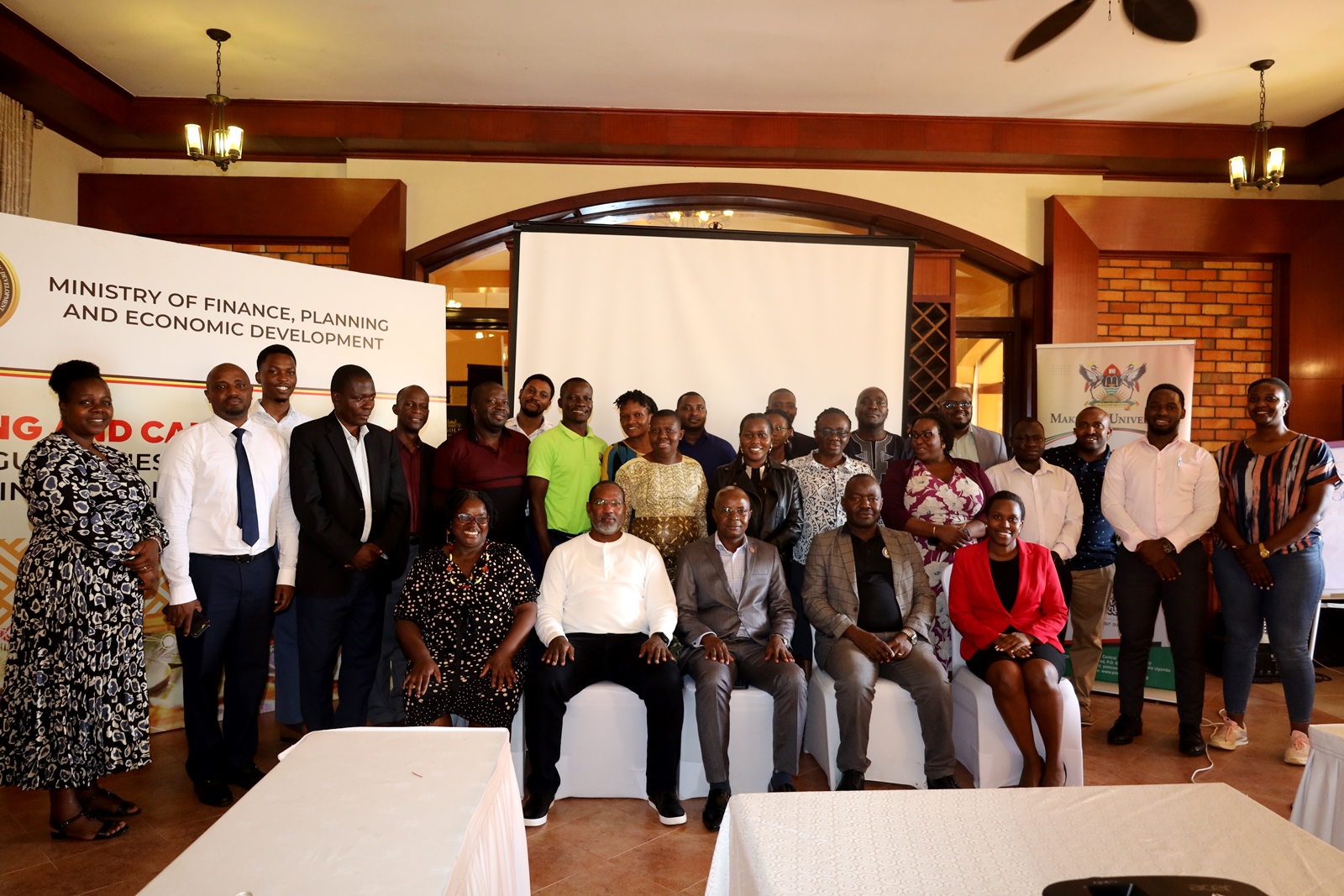 Group photo of participants. Public Investment Management Centre of Excellence (PIMCoE), hosted by the College of Business and Management Sciences, Makerere University, Kampala Uganda, East Africa, training of its 4th cohort of public officers on User Acceptance Training on Guidelines for Clearance of Financial Implications, November 15, 2024.