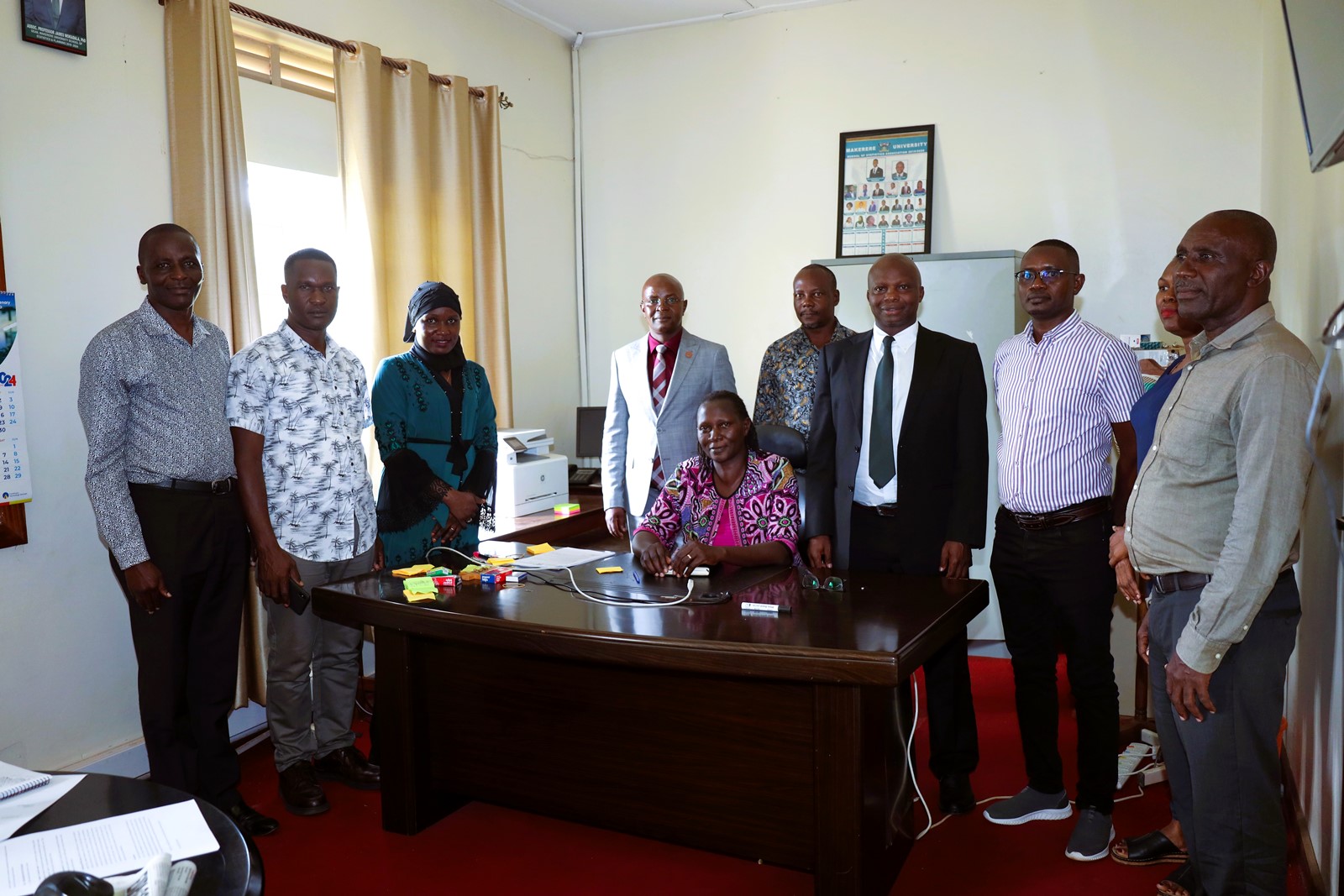 A group photo of the people that attended the handover ceremony. Dr. James Wokadala official handover of Dean of the School of Statistics, College of Business and Management Sciences (CoBAMS), Makerere University, Kampala Uganda, East Africa to Dr. Margaret Banga, Friday 8th November 2024.