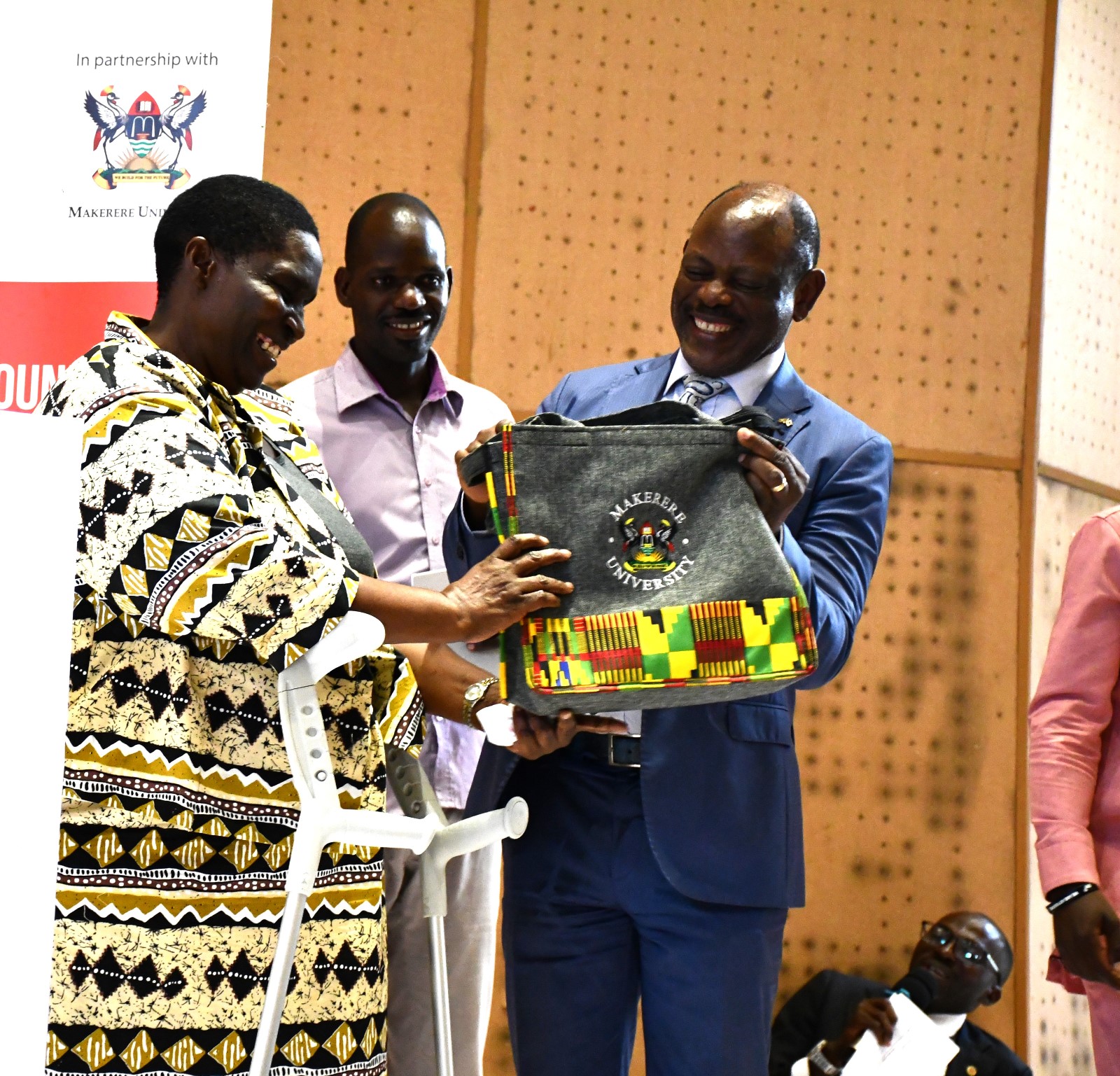 Prof. Nawangwe handing over a gift to the Chief Guest, Hon Asamo. Office of the Dean of Students and the 90th Students' Guild-Ministry of Students with Disabilities inaugural International Day of Persons with Disabilities commemoration, 13th November 2024, Yusuf Lule Central Teaching Facility Auditorium, Makerere University, Kampala Uganda, East Africa.