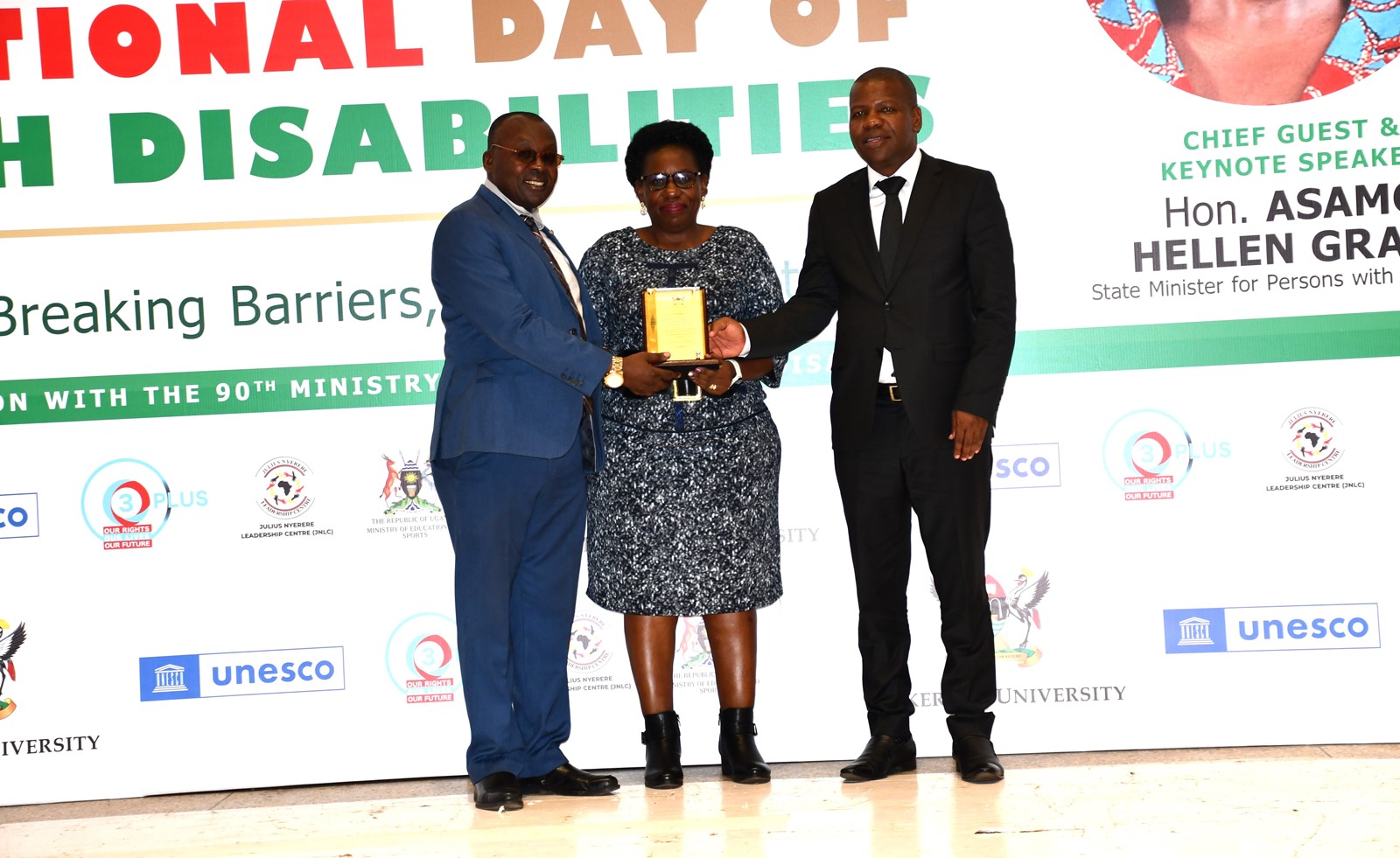 Prof. Justine Namaalwa, the Program Director of Mastercard Foundation Scholars Program receiving the award on behalf of the Team. Office of the Dean of Students and the 90th Students' Guild-Ministry of Students with Disabilities inaugural International Day of Persons with Disabilities commemoration, 13th November 2024, Yusuf Lule Central Teaching Facility Auditorium, Makerere University, Kampala Uganda, East Africa.