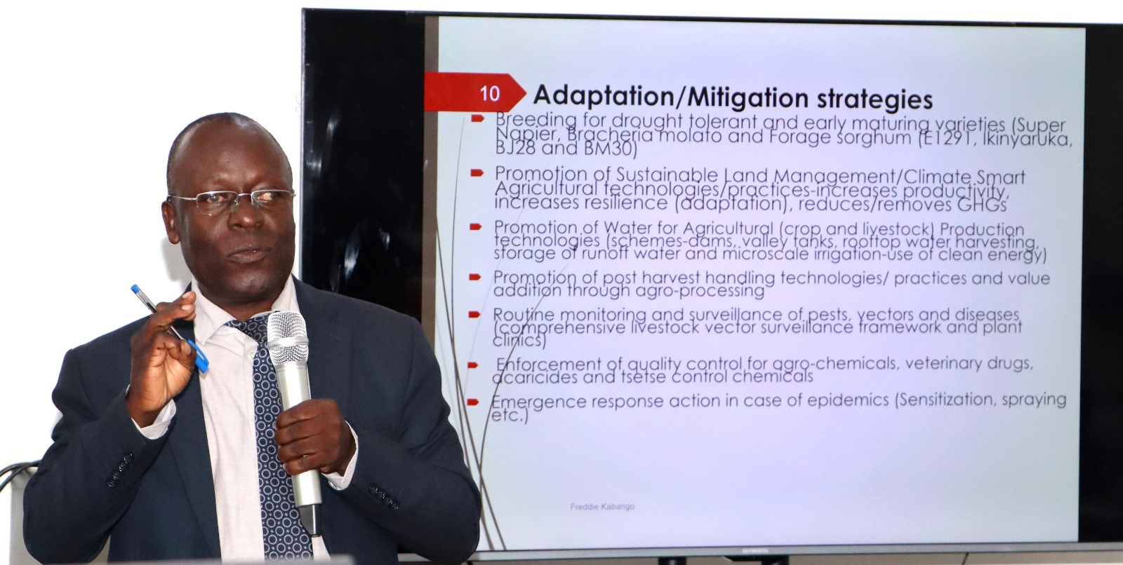 MAAIF Commissioner Freddie Kabango presenting Government Climate Adaption and Mitigation Strategies. Department of Geography, Geo-informatics, and Climatic Sciences at Makerere University, in collaboration with the Department of Geography at Kyambogo University, workshop to disseminate research findings from three climate adaptation and mitigation projects funded by the Regional Universities Forum for Capacity Building in Agriculture (RUFORUM), RAINCA, WASCAL, Akademiya2063, and the Carnegie Corporation of New York under the CECAP Program, 19th December 2024, GIS Lab, CoCIS Block A, Makerere University, Kampala Uganda, East Africa.