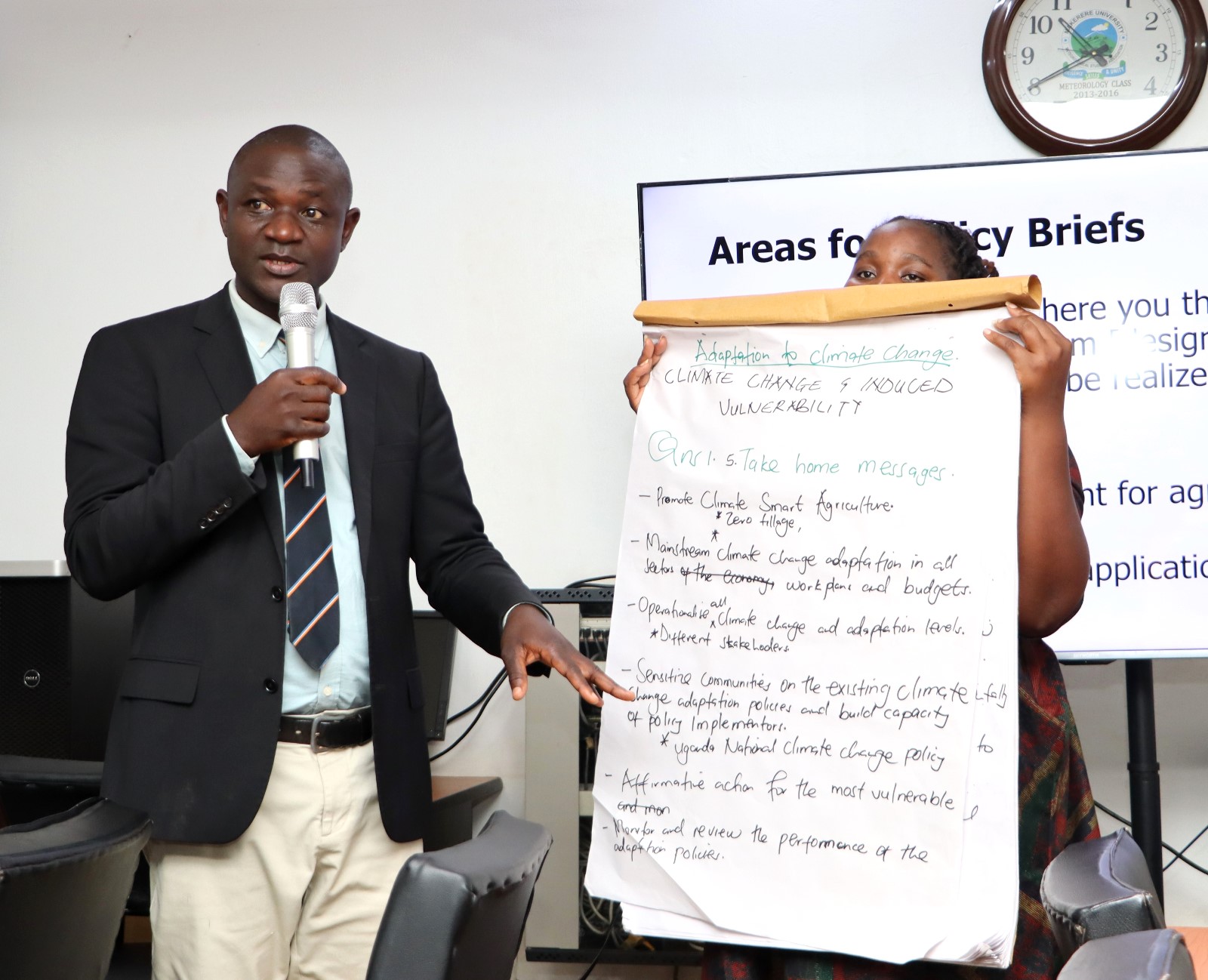 Representatives of Group two presenting the results of their discussions. Department of Geography, Geo-informatics, and Climatic Sciences at Makerere University, in collaboration with the Department of Geography at Kyambogo University, workshop to disseminate research findings from three climate adaptation and mitigation projects funded by the Regional Universities Forum for Capacity Building in Agriculture (RUFORUM), RAINCA, WASCAL, Akademiya2063, and the Carnegie Corporation of New York under the CECAP Program, 19th December 2024, GIS Lab, CoCIS Block A, Makerere University, Kampala Uganda, East Africa.