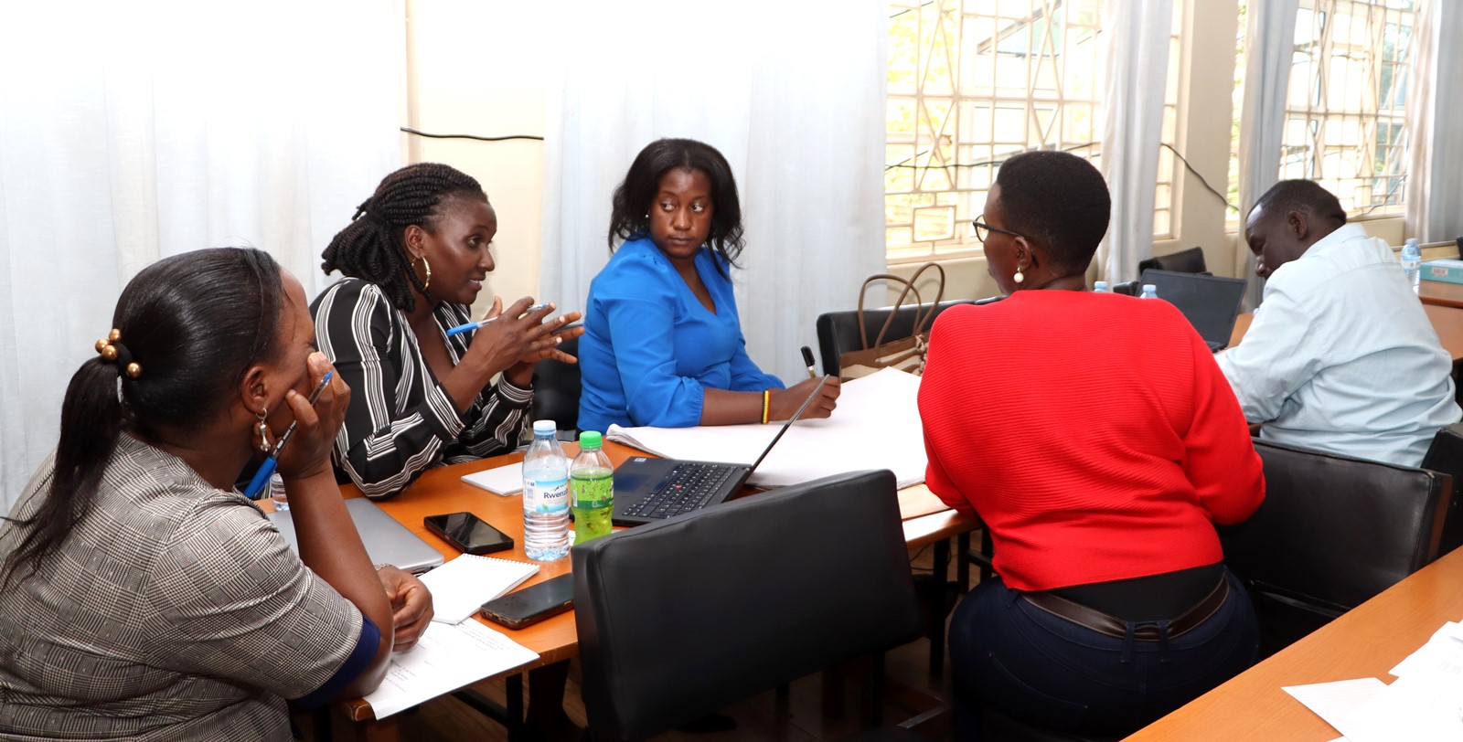 Group three during the discussion session. Department of Geography, Geo-informatics, and Climatic Sciences at Makerere University, in collaboration with the Department of Geography at Kyambogo University, workshop to disseminate research findings from three climate adaptation and mitigation projects funded by the Regional Universities Forum for Capacity Building in Agriculture (RUFORUM), RAINCA, WASCAL, Akademiya2063, and the Carnegie Corporation of New York under the CECAP Program, 19th December 2024, GIS Lab, CoCIS Block A, Makerere University, Kampala Uganda, East Africa.