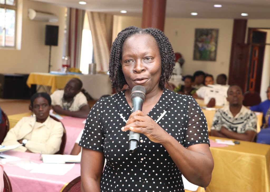 Secretary Joyce Hatemere speaking during the discussions. The College of Humanities and Social Sciences (CHUSS), Makerere University first-ever non-academic staff retreat, December 7-8, 2024, Grand Global Hotel, Kikoni, Kampala Uganda, East Africa.