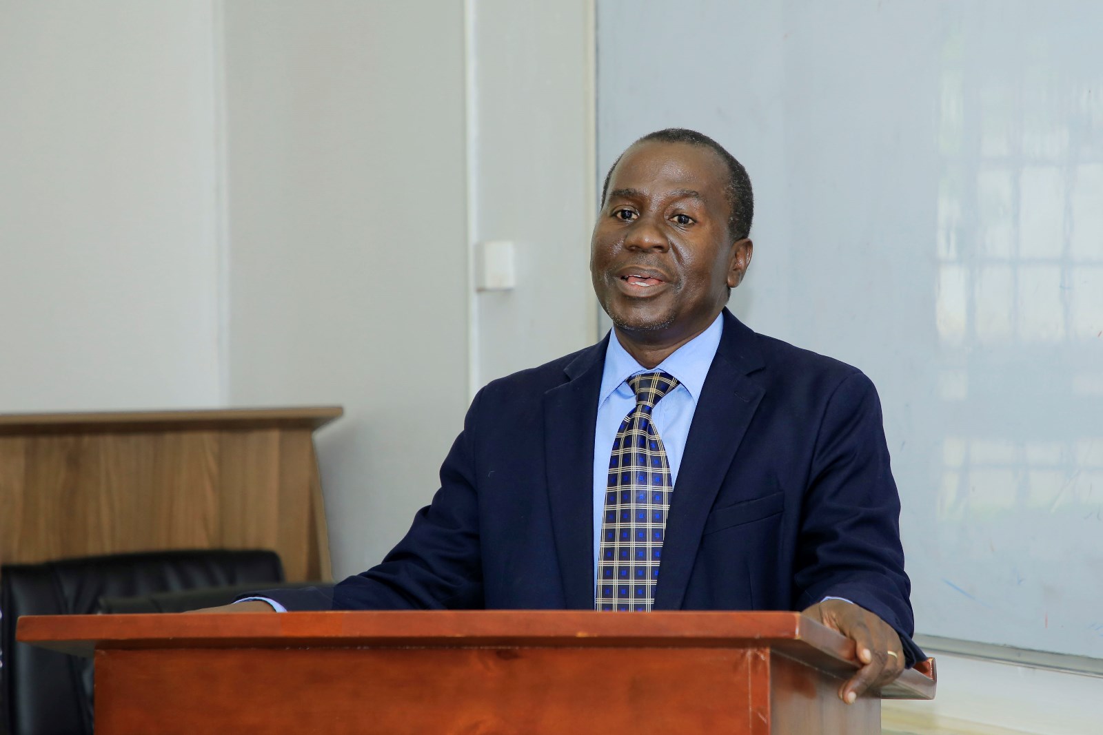 Dr. Enock Sebuyungo making his opening remarks. School of Languages, Literature, and Communication stakeholders’ workshop to review the Bachelor of Chinese and Asian Studies (BICAS) program, 5th December, 2024, Smart Room, College of Humanities and Social Sciences (CHUSS), Makerere University, Kampala Uganda, East Africa.