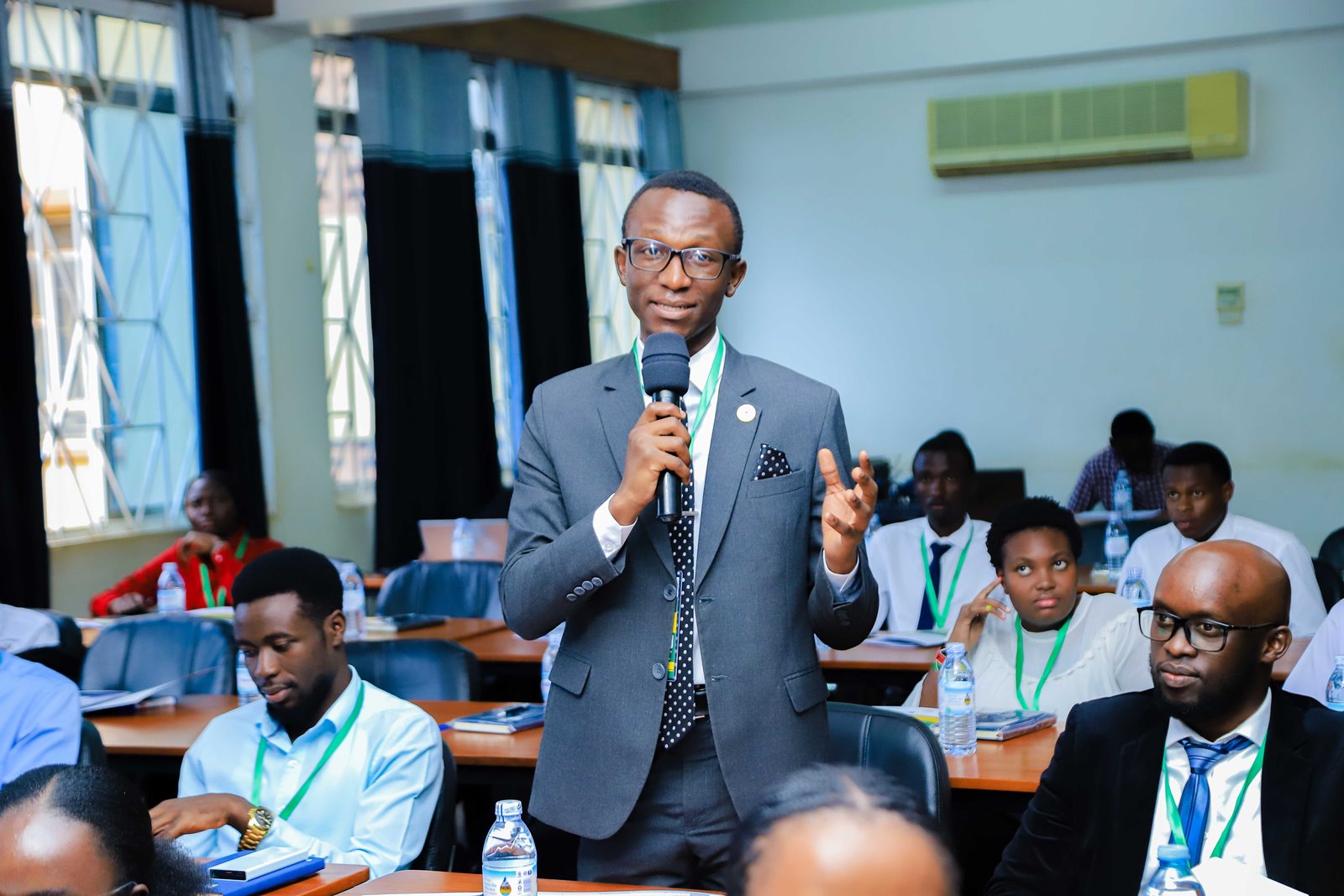 A male student leader contributes to the discussion. Konrad Adenauer Stiftung-Julius Nyerere Leadership Centre (JNLC) Peace and Security Leadership Training for Finalists and Graduating former Student Leaders in Different Universities in Uganda, Day one, 3rd December 2024, Telepresence Centre, Senate Building, Makerere University, Kampala, East Africa.