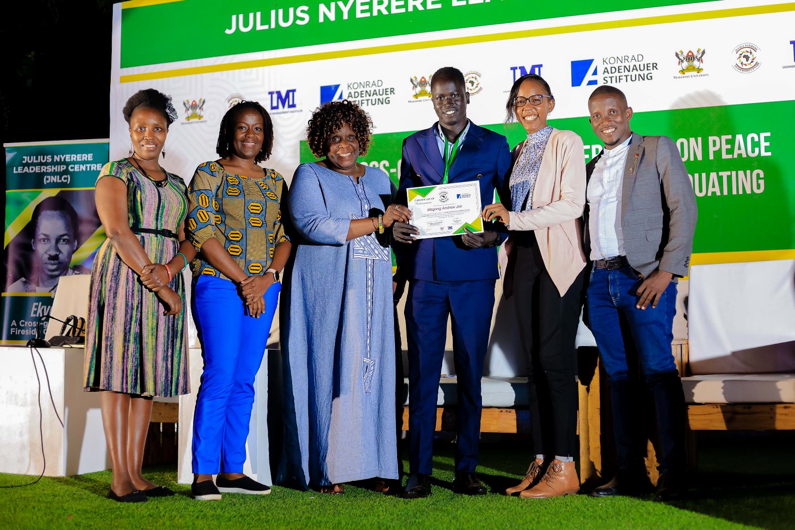 A Male Student Leader-Magong Andrew Jok receives his certificate at the end of the training. Konrad Adenauer Stiftung-Julius Nyerere Leadership Centre (JNLC) Peace and Security Leadership Training for Finalists and Graduating former Student Leaders in Different Universities in Uganda, Day Three, 5th December 2024, JNLC Gardens, Pool Road, Makerere University, Kampala Uganda, East Africa.