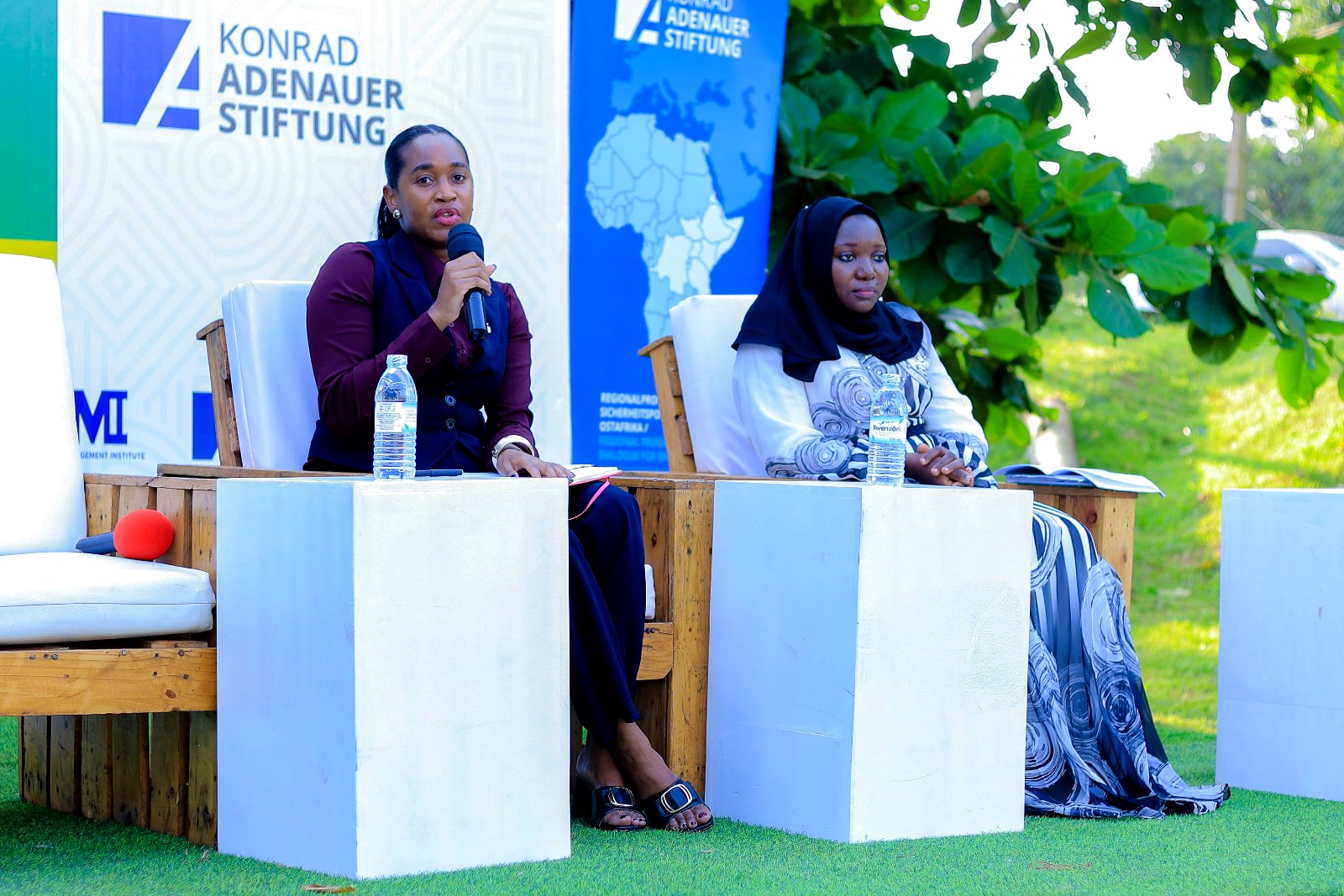 Ms. Joanna Grace Nakabiito (Left) and Ms. Nashiba Nakabira (Right) during the panel discussion. Konrad Adenauer Stiftung-Julius Nyerere Leadership Centre (JNLC) Peace and Security Leadership Training for Finalists and Graduating former Student Leaders in Different Universities in Uganda, Day Three, 5th December 2024, JNLC Gardens, Pool Road, Makerere University, Kampala Uganda, East Africa.